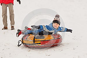 Picture of boy on tubing in winter park