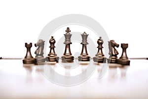 Picture of chess board game and black chess pawns