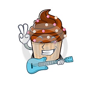 A picture of chocolate cupcake playing a guitar