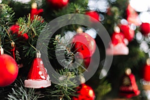 Picture of christmas tree with red balls, lights and spruce branch. new year background with space for text