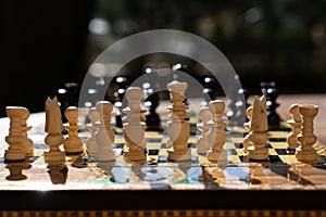 Close-up of chessboard with chess pieces photo