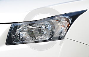 Picture of Closeup headlights of car.