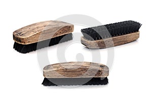 Closeup old wood shoebrush isolated on white background photo