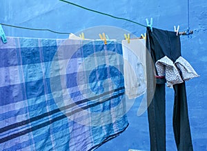 This is a picture of a clothesline with clothes dried on it