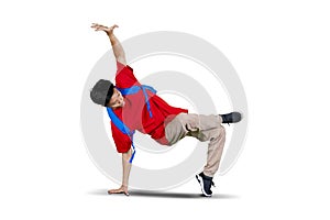 College student doing break dance in studio
