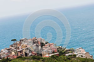 Picture of colorful buildings on a cliff surrounded by water in Port-Cros HyÃÂ¨res, France photo