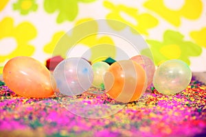 Picture of colorful organic holi color and water balloons for holi fun