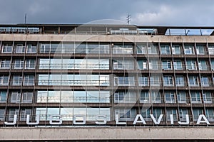 Picture of a Communist era building with the word Yugoslavia Jugoslavia written in front of it