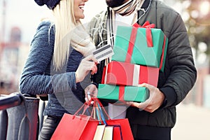 Picture of couple shopping for Christmas in the city