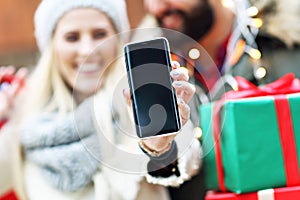 Picture of couple shopping for Christmas in the city