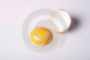 Egg broken on white background