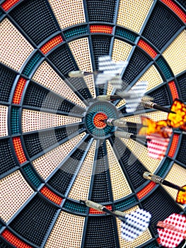 Picture of Darts arrow hitting in the target center of dartboard. concept business goal to marketing success. Business target or
