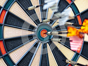 Picture of Darts arrow hitting in the target center of dartboard. concept business goal to marketing success. Business target or