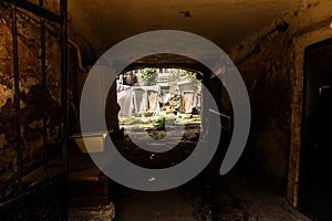 Picture for decoration of a vintage retro interior. Odessa. An old authentic courtyard with an arch and dried clothes on the ropes