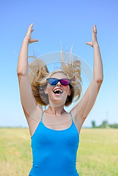 Picture of delighted happy young blond woman with