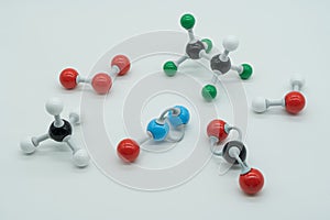 Picture of different greenhouse gases made by molecular model on white background.