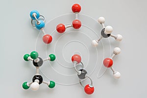 Picture of different greenhouse gases made by molecular model on white background.