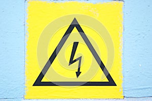 Picture of dilapidated sign Caution high voltage