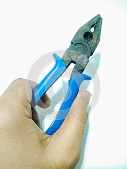 A picture of electric wire cutter on white surface ,