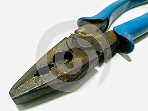 A picture of electric wire cutter on white surface ,