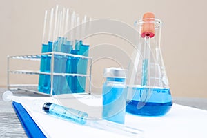 Picture of the experimenting the blue vaccine liquid with scientific equipment