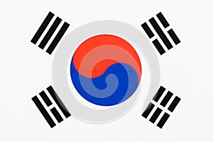 Picture of a fabric flag of South Korea aka Taegukgi full frame with Taegeuk and trigrams