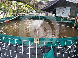 picture of fish farming round pond tarpaulin