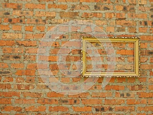 Picture frame from baguette on the background of an old brick wall