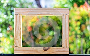 Picture frame on blurred tree backgroud using wallpaper or background for idea work.