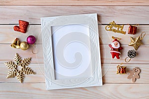 Picture frame and Christmas decoration - Santa Clause and gift on wooden table. Christmas and Happy new year concept