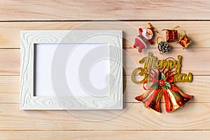 Picture frame and Christmas decoration - Santa Clause and gift on wooden table. Christmas and Happy new year concept