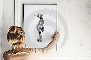 Picture frame mockup with a seahorse drawing