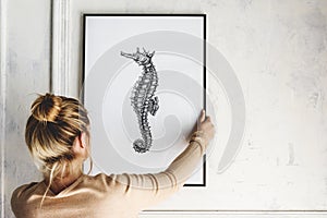 Picture frame mockup with a seahorse drawing photo