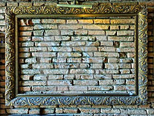 Picture frame on an old wall in lowlight