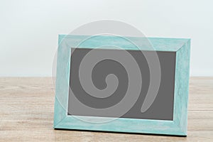 Picture frame on wooden texture background