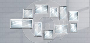 Picture frames on white brick wall