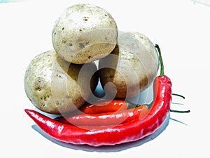 A picture of fresh potato with red chili