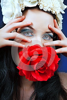 Picture of gorgeous woman holding beautiful red rose