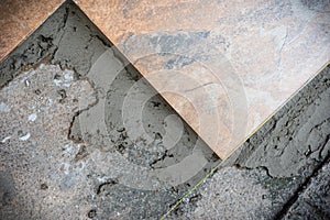 The picture of Granito tiles that have been decorated on the concrete floor photo