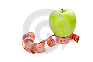 Picture of green apple with type-measure isolated on white. Hea