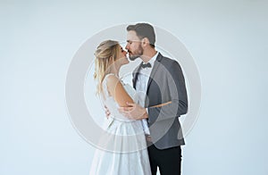 Picture of groom with bride romantic couple is kissing and hugging together on white background,Positive thinking in wedding day,C