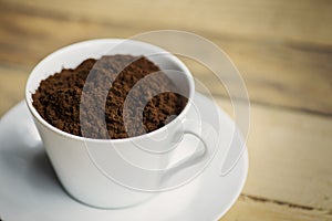 Picture of ground coffee in white cup