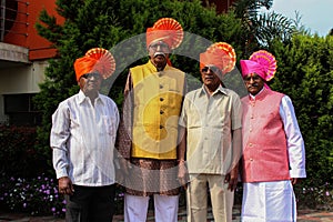 Picture of group of Indian people smiling and posing for a photo at wedding