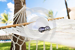 Picture of hammock with white hat and sunglasses