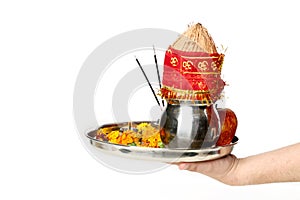 Picture of hand is holding pooja thali for navratri festival