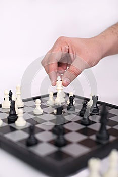 Picture of hand is playing chess