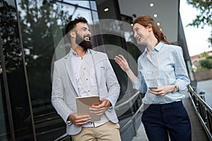 Picture of handsome man and beautiful woman as business partners