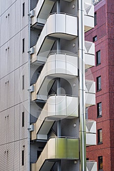 high-rise residential building with external stairs in Tokyo, Japan