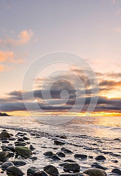 Picture of an idyllic view of the seashore at sunset photo