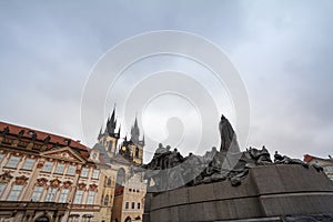 Jan Hus Memorial, on Staromestske Namesti, the Old Town Square of Prague, Czech Republic, with the church of our lady before tyn i photo